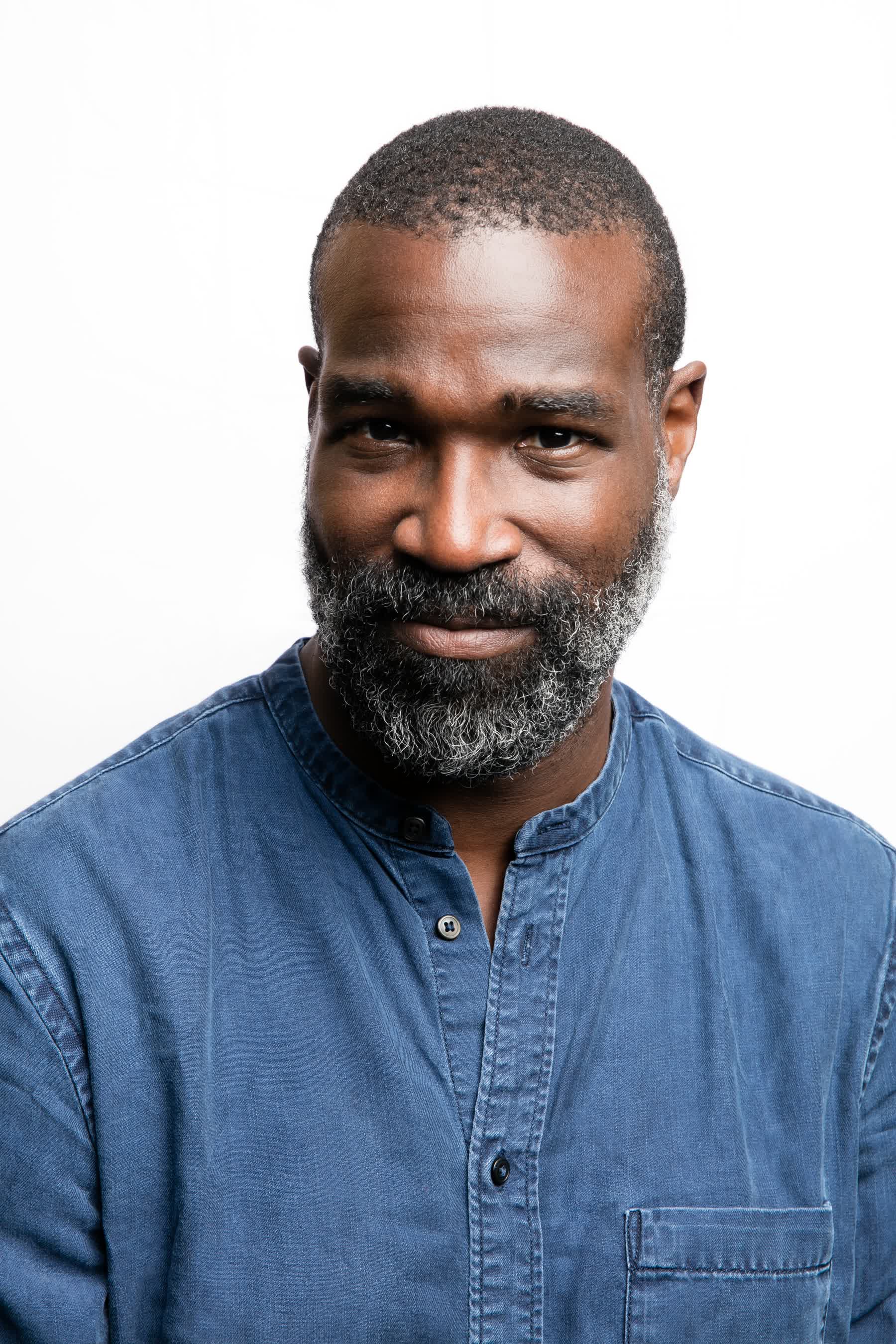 actor Tunde Adebimpe large photo