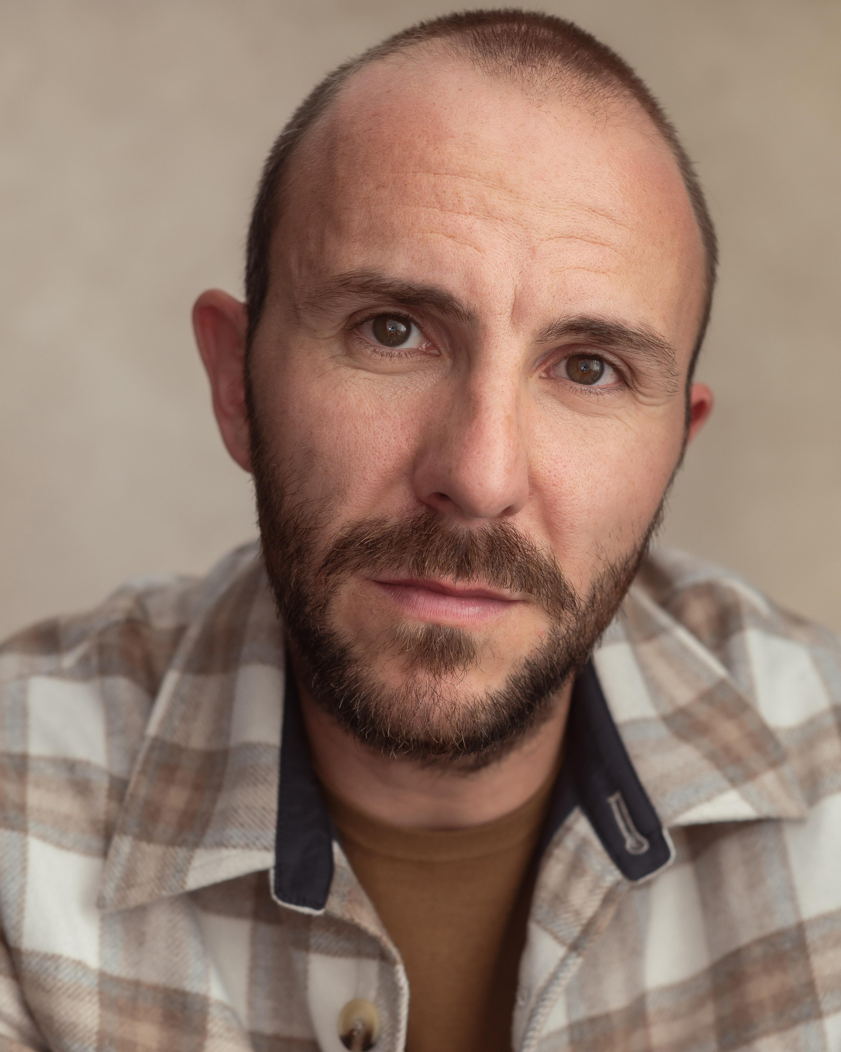 actor John Tueart large photo