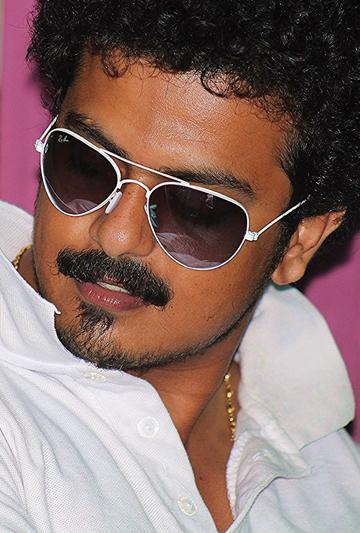 actor Justin John large photo