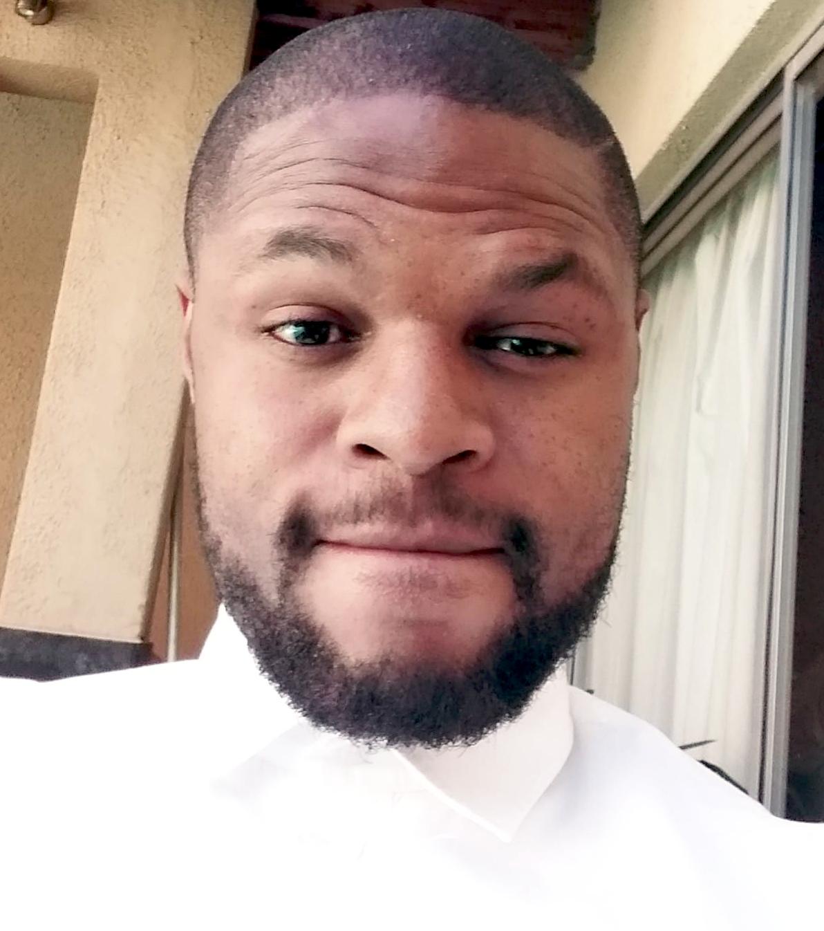 actor Andile Gumbi large photo