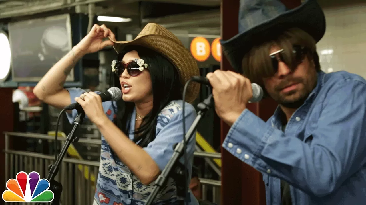 Miley Cyrus Busks in NYC Subway in Disguise backdrop