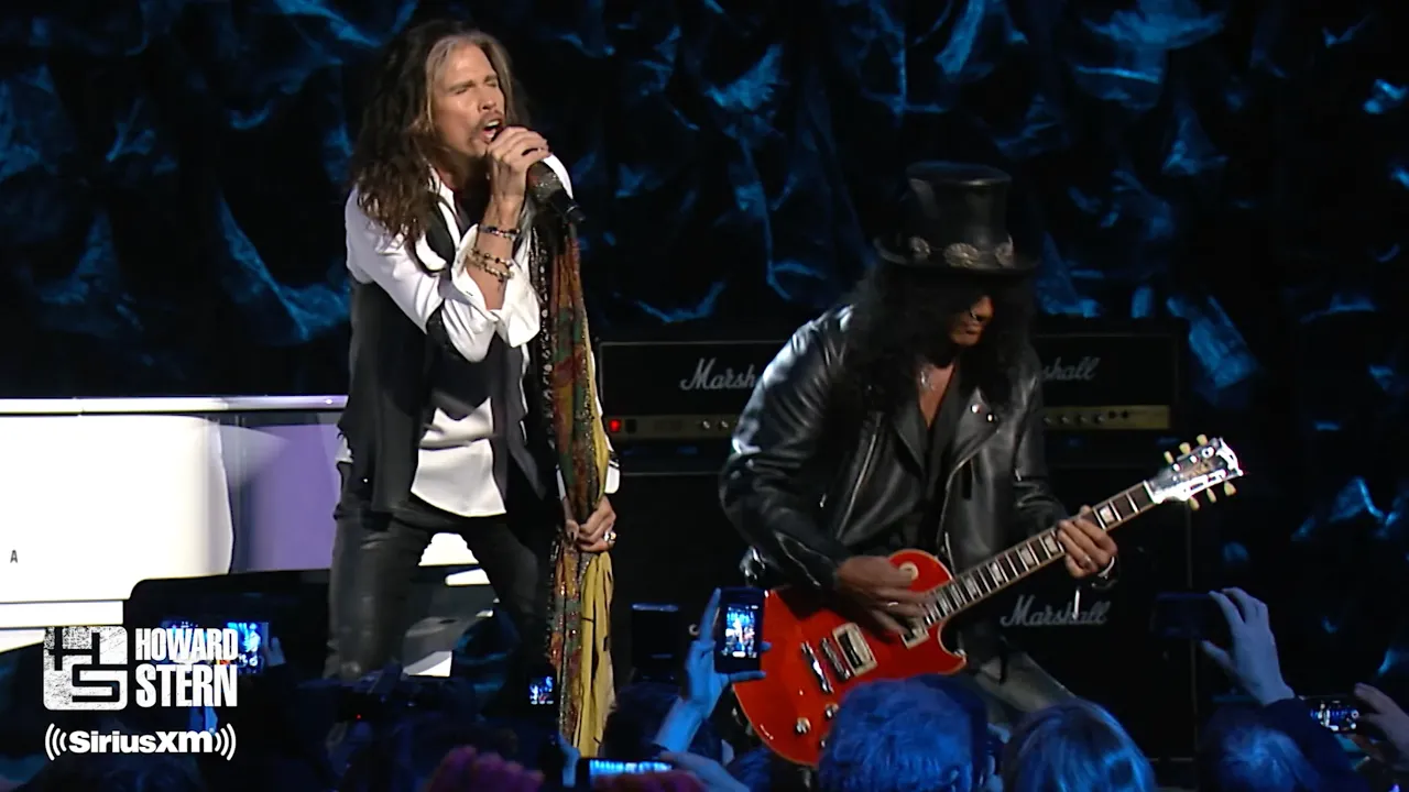Steven Tyler, Slash, and Train “Dream On” at the Howard Stern Birthday Bash (2014) background