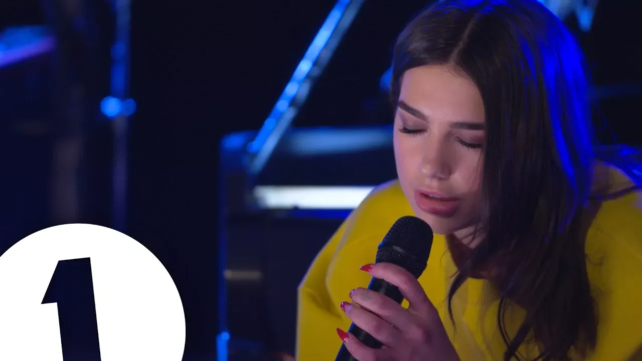Dua Lipa covers Arctic Monkeys Do I Wanna Know in the Live Lounge background