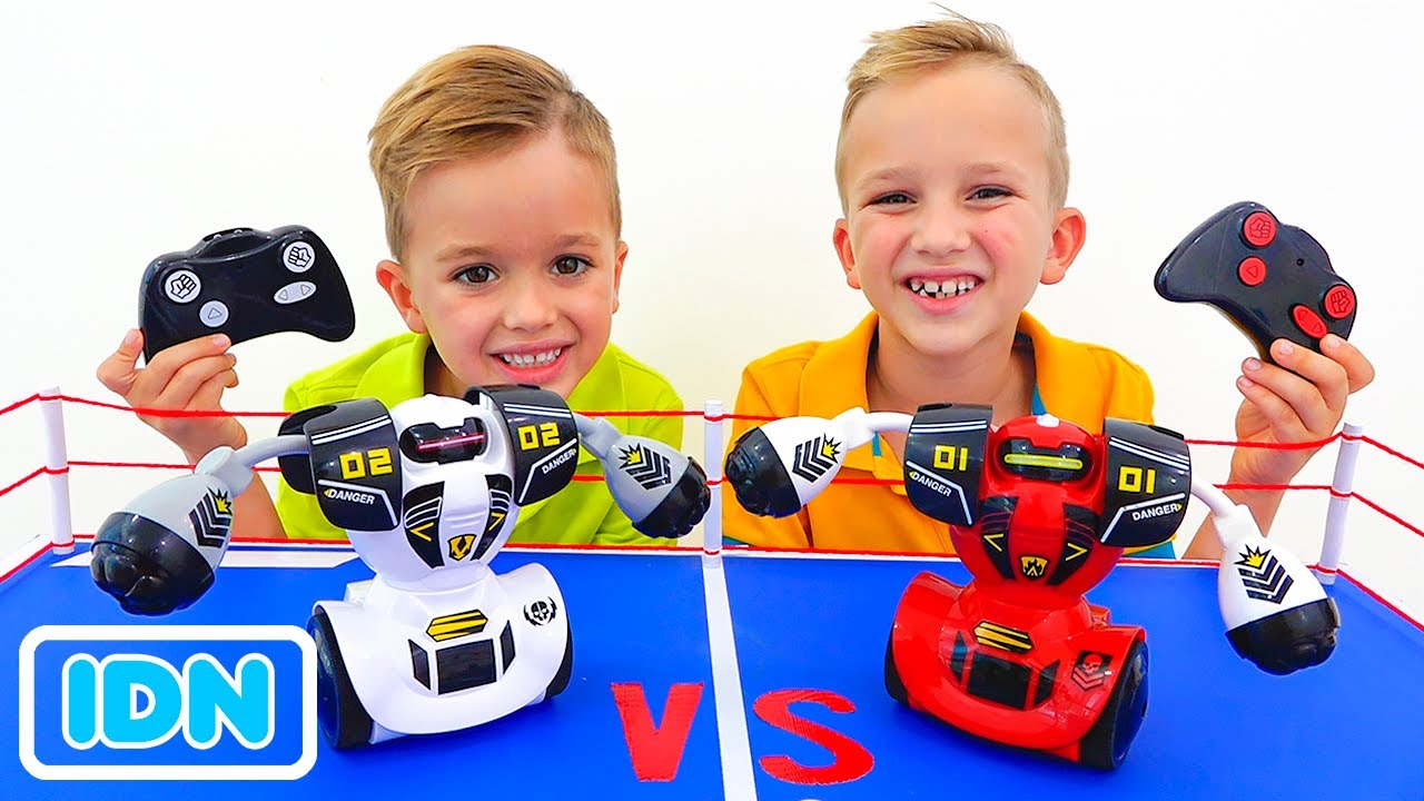 Vlad dan Niki bermain dengan mobil mainan RC & robot background