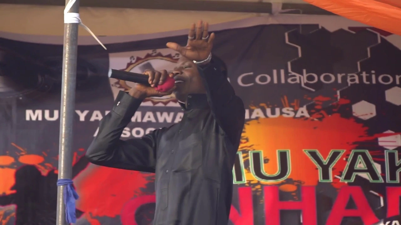 ADO GWANJA On Stage backdrop