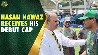 Pakistan’s ODI player #254 Hasan Nawaz receives his debut cap from Team Manager Naveed Akram Cheema backdrop