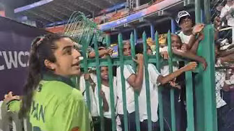 Pakistan women's team players interact with Sri Lankan fans at R Premadasa Stadium, Colombo backdrop