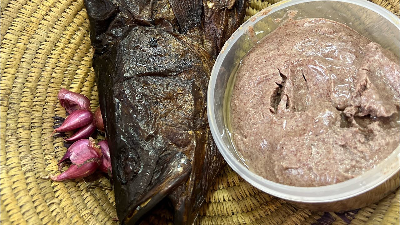 Smoked Nile perch in gnut sauce background