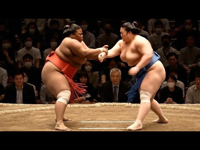 Japanese Female Sumo Wrestling Festival - Two Heavy Duty Women Sumo Champions Collide background