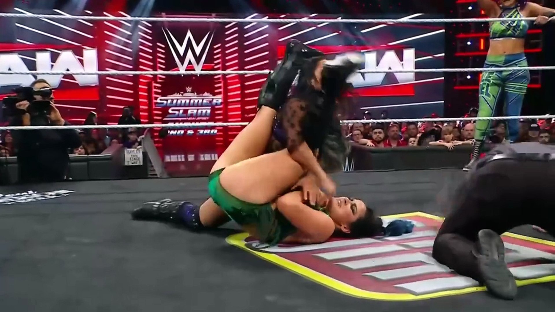 The Judgment Day (Roxanne Perez & Raquel Rodriguez) vs. Bayley & Lyra Valkyria - WWE Women's Tag Team Championship - Raw July 21, 2025 background