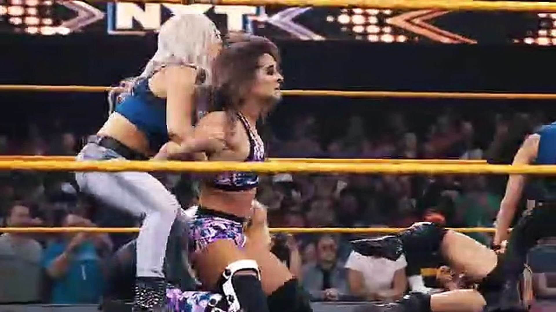 WWE Women's Division brawl breaks out between RAW, Smackdown & NXT background