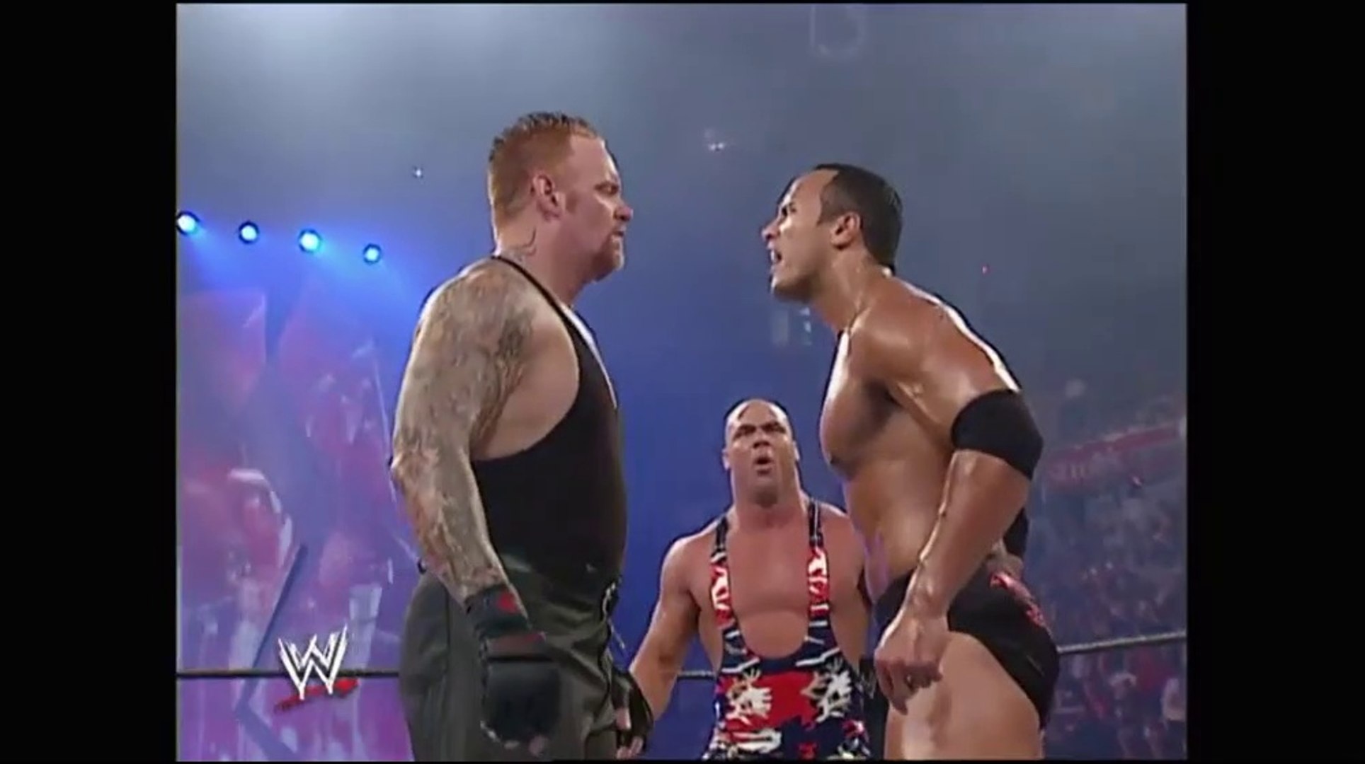 The Rock vs. Kurt Angle vs. The Undertaker (WWE Vengeance 2002) background