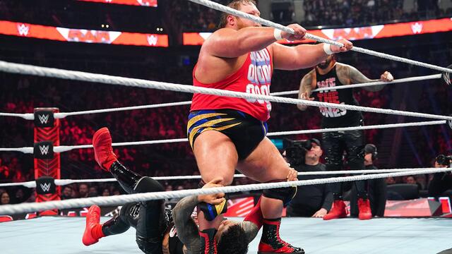 Otis struts across the ring with Jey Uso hanging on to his feet on Raw