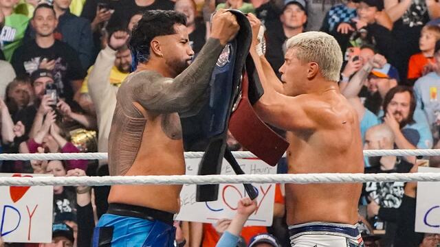Cody Rhodes and Jey Uso celebrate winning the Undisputed WWE Tag Team Titles: WWE Fastlane 2023 highlights background