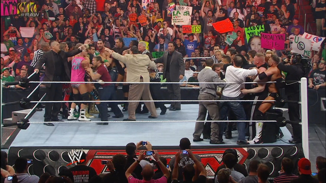 John Cena and Brock Lesnar brawl after John Laurinaitis reveals they will meet at Extreme Rules: Raw, April 9, 2012 background
