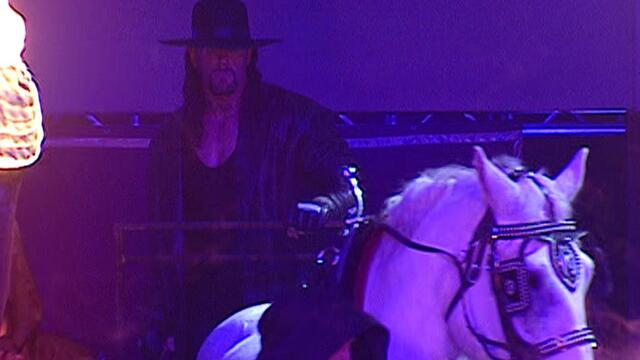 The Undertaker uses his powers to destroy the ring while Kurt Angle is in it: Royal Rumble 2006 background