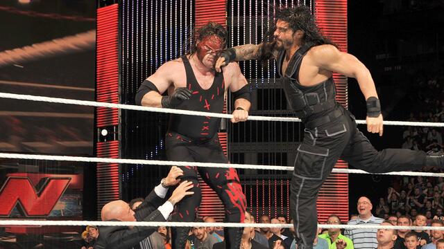 Roman Reigns sparks a massive brawl with Kane: Raw, July 7, 2014 backdrop