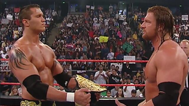 Randy Orton spits in Triple H's face