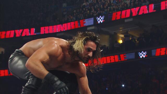 Brock Lesnar vs. John Cena vs. Seth Rollins - WWE World Heavyweight Championship Match: WWE Royal Rumble 2015 backdrop