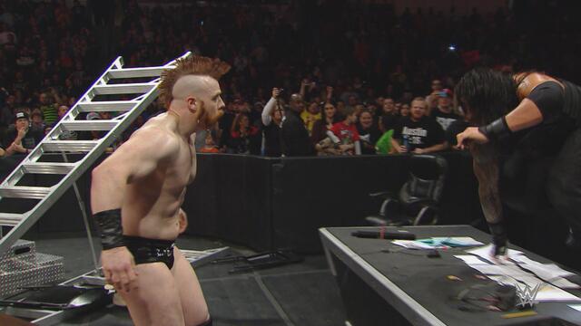Roman Reigns Spears Sheamus through a table: Raw, Dec. 7, 2015 background
