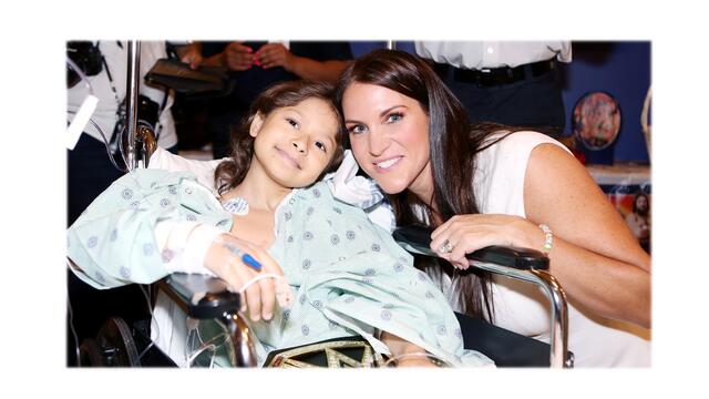 Superstars kick off SummerSlam Week by visiting Children's Hospital at Montefiore background