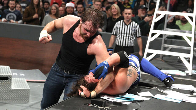 Dean Ambrose flattens AJ Styles with an elbow drop from a ladder: WWE TLC 2016 (WWE Network Exclusive) background