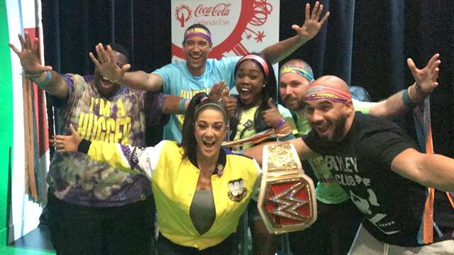 Bayley hugs it out with her many fans background