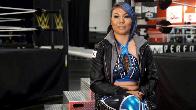 Mia Yim is ready to achieve her dream inside a WWE ring backdrop