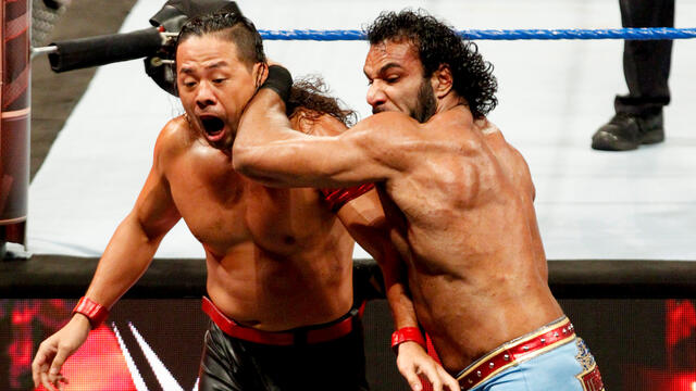 WWE Champion Jinder Mahal tosses Shinsuke Nakamura over the ringside barrier: WWE Hell in a Cell 2017 (WWE Network Exclusive)