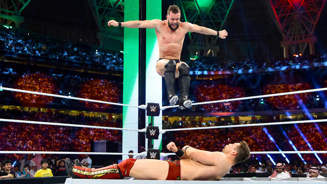 Finn Bálor crushes The Miz with a Coup de Grâce on top of a ladder: Greatest Royal Rumble (WWE Network Exclusive) background