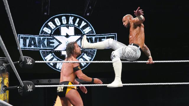 Ricochet's leaping hurricanrana launches Adam Cole off the ring apron: NXT TakeOver: Brooklyn IV (WWE Network Exclusive)