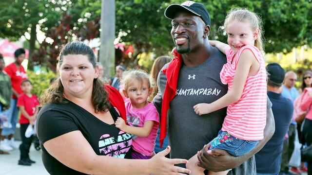 Titus O'Neil gives out 15,000 backpacks to schoolkids: WWE Now background