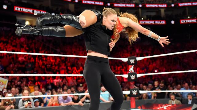 Ronda Rousey charges from the crowd in Extreme Rules Match: WWE Now background