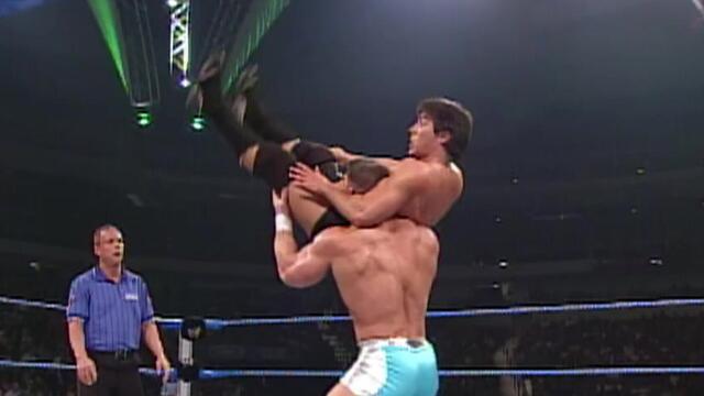 John Cena uses the Protobomb to win the match: WWE Velocity, December 7, 2002 background