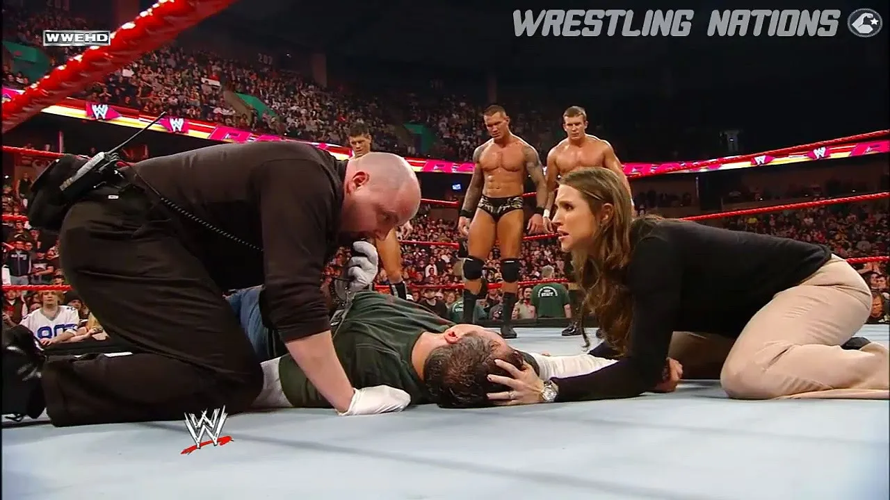 Shane and Stephanie Destroyed by Randy Orton WWE Raw background