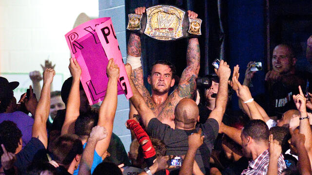 New champions celebrating with fans: WWE Playlist background
