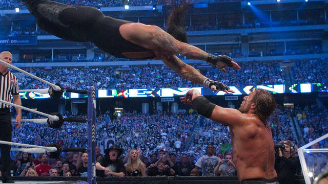 Undertaker and Triple H beat the hell out of each other: A&E Rivals Undertaker vs. Triple H