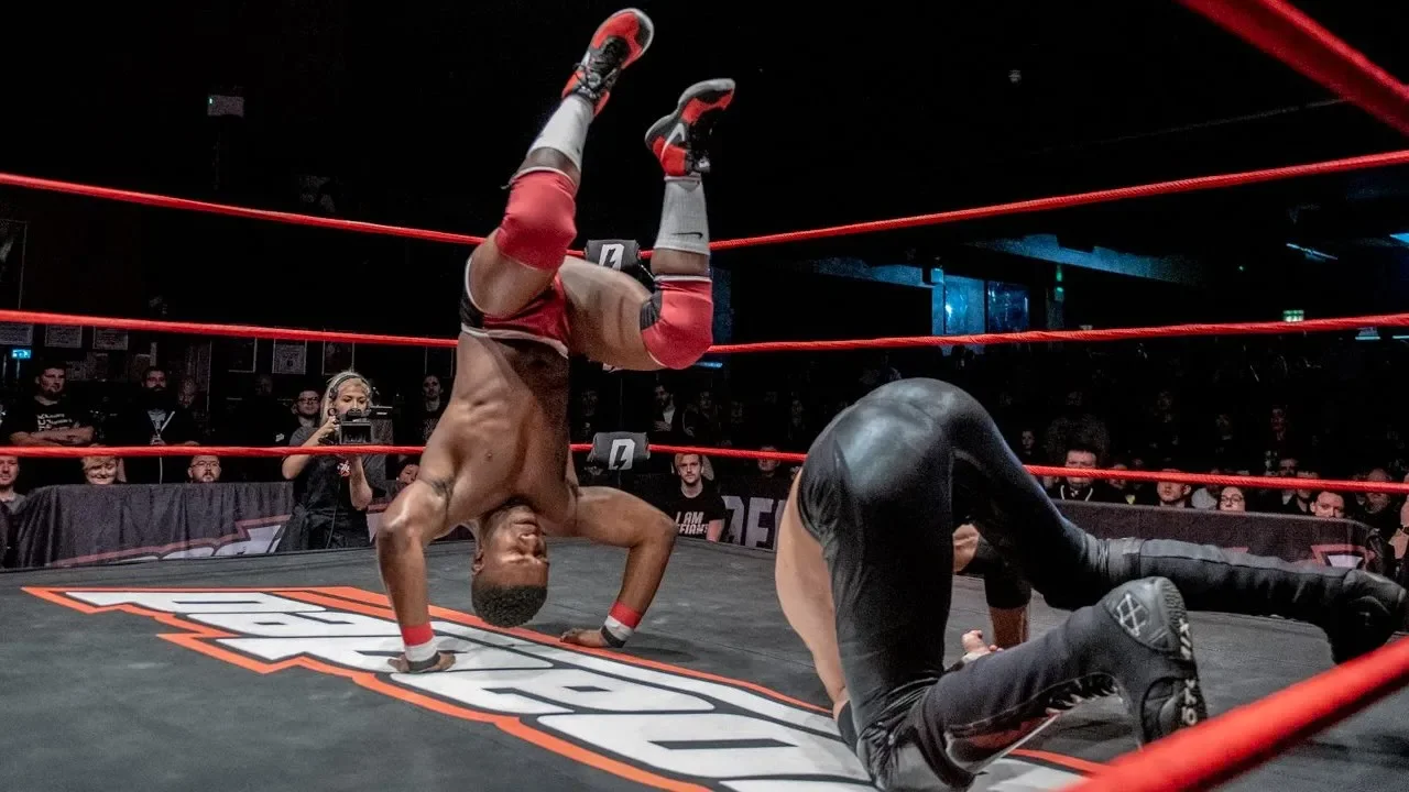 El Phantasmo Vs. Man Like Dereiss (Defiant Loaded #5) background