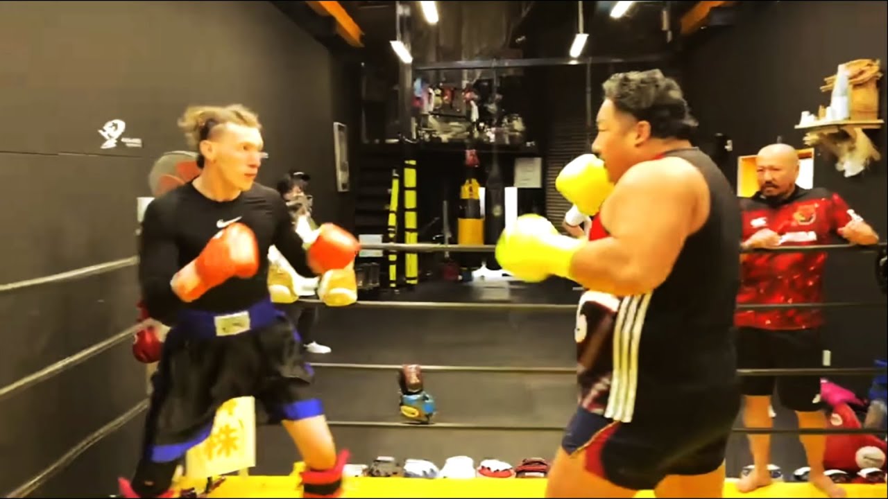 Rugby Player Takes On Two Kickboxers background