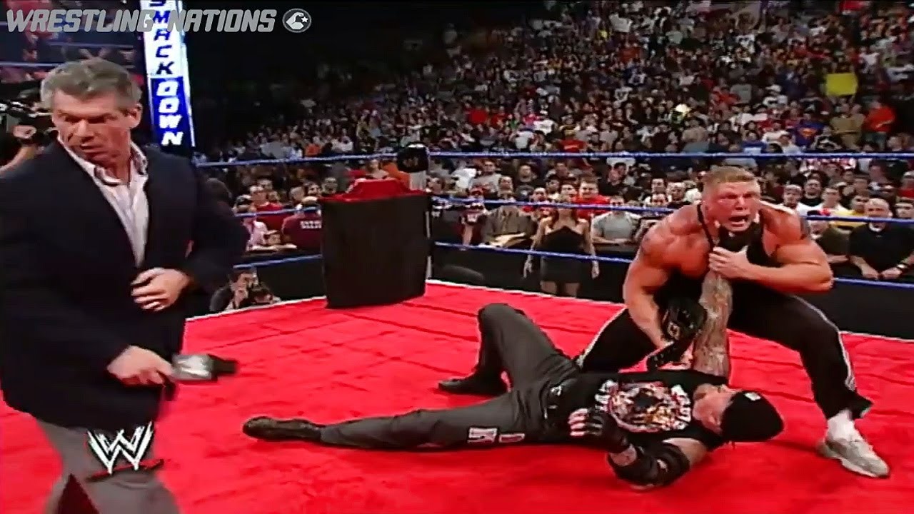 Undertaker and Brock Lesnar Segment ends in a Chokeslam background