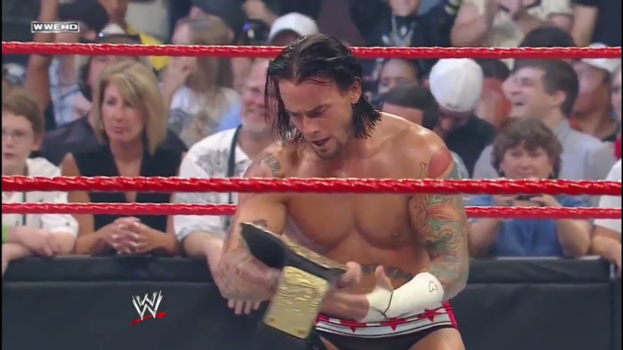 CM Punk cashes his Money In The Bank contract on Edge to become World Heavyweight Champion background