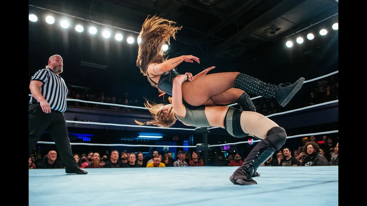 Skye Blue vs Liiza Hall background