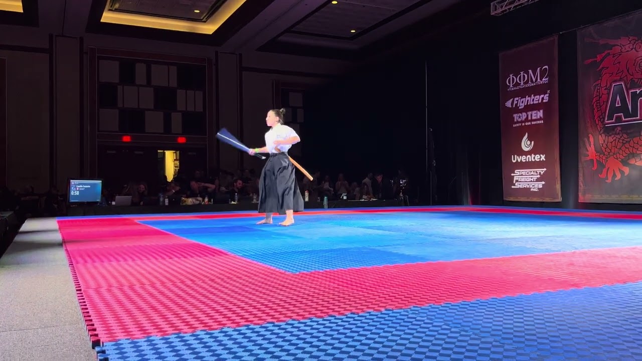 Camille Couturier Traditional Weapons Overall Grand Championship - AmeriKick Internationals 2025 background