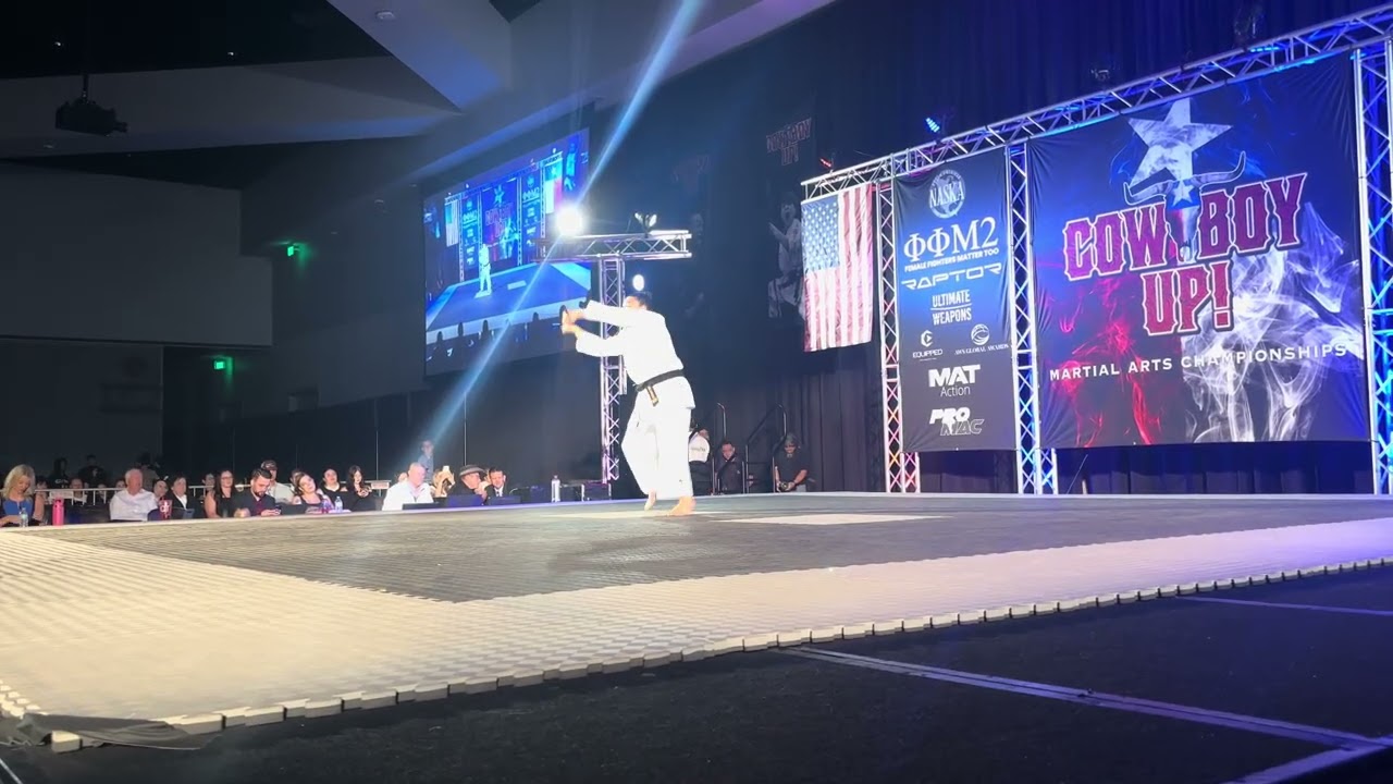 Katelyn McMillan Women's Traditional Weapons Overall Grand Championship - Cowboy Up 2025 background