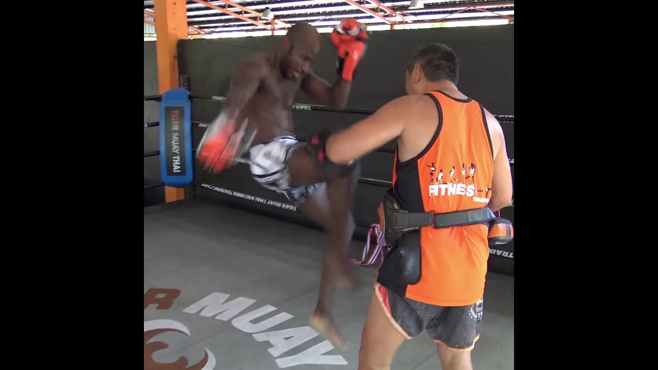 Lumpinee stadium MMA fight prep: John Shink hits pads with Kru Sawat