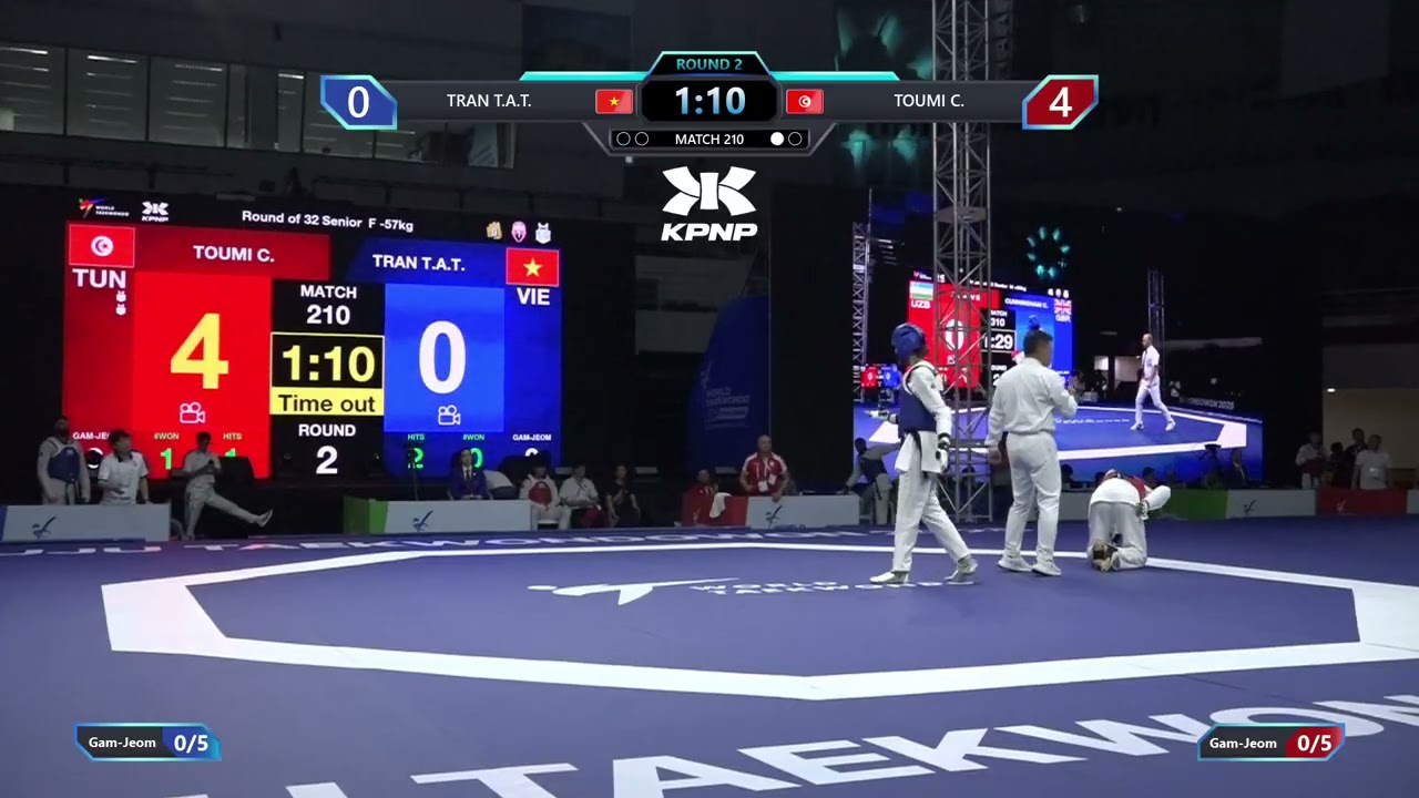 210 Round of 32 F 57kg VIE TRAN T A T TUN TOUMI C PGM background