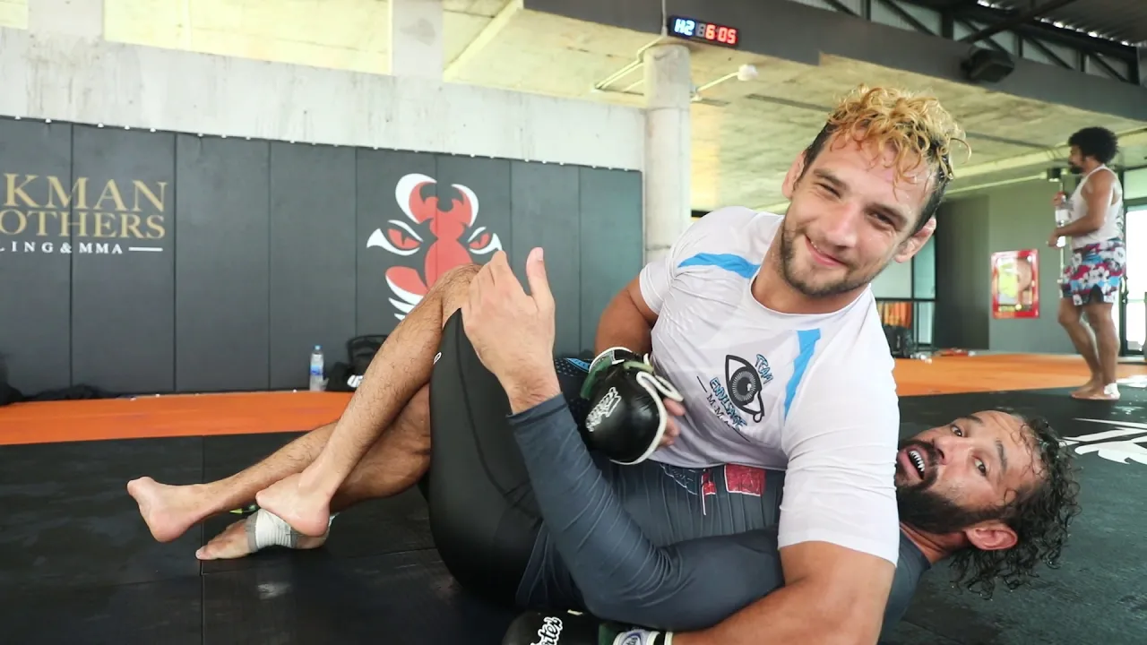 BJJ Black Belt Joseph Henle sharing some arm triangle choke and half guard tips background