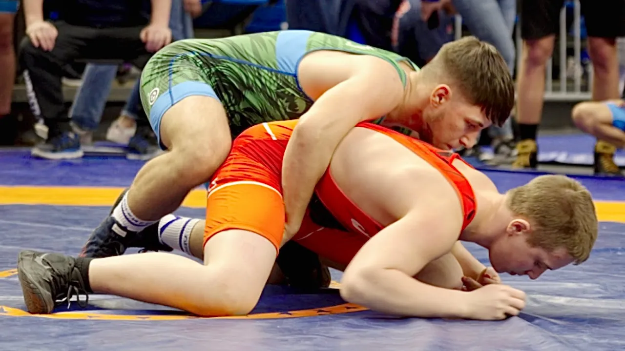 U15 Tahir Albayrak (FIN) vs Petko Sarakostov (BUL) 62kg. Freestyle boys wrestling. B-cam-man background