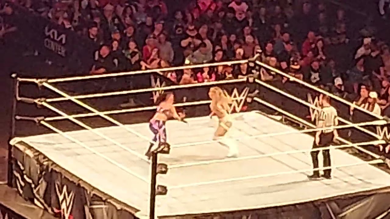 Tiffany Stratton vs Bayley at WWE Live Holiday Tour background
