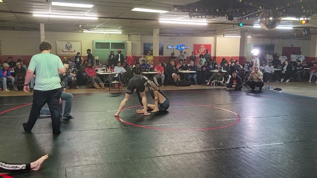 Young Roger Gracie look alike secures heel hook finish. Good view of classic technique.